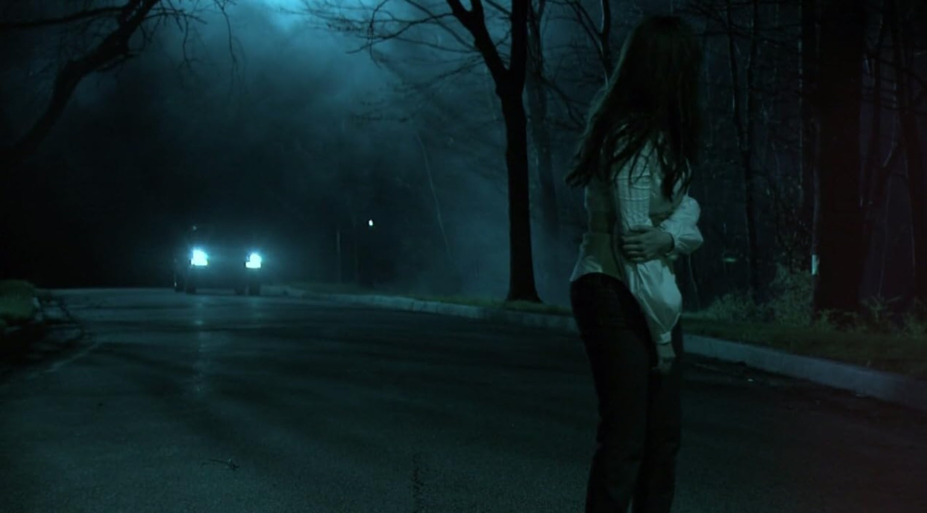 Headlights on the night road